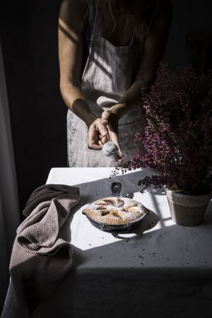 Woman cutting plum cake