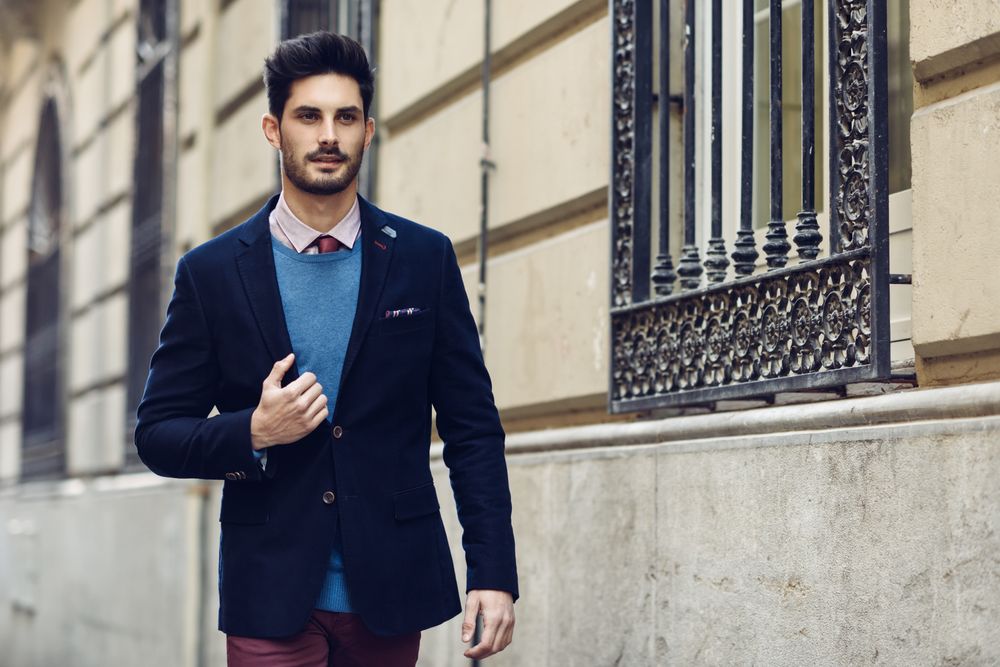 Attractive man in the street wearing elegant suit
