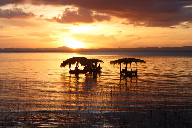Laundry in sea at sunset