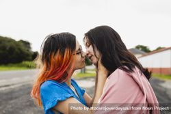 A young lesbian couple kiss outside 0WOOBW