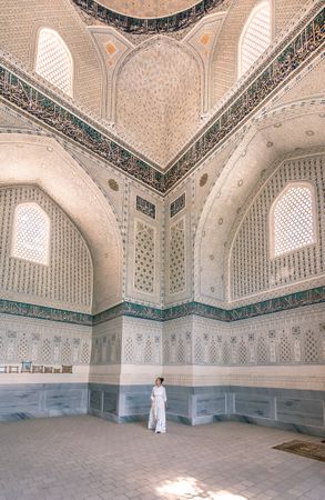 Unrecognizable tourist inside ancient building