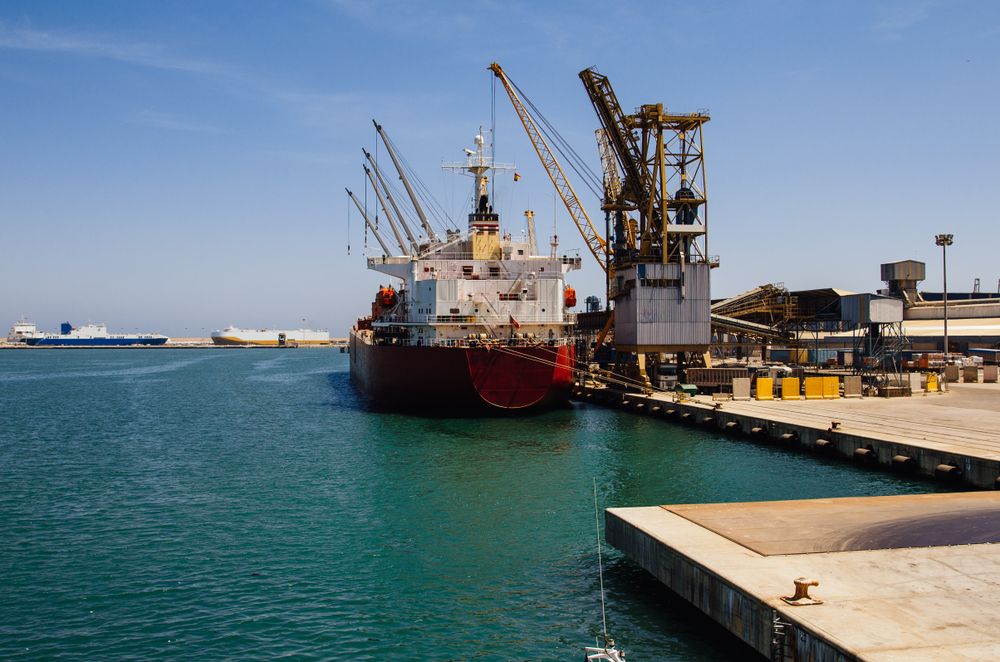 Ship in a container terminal by the sea