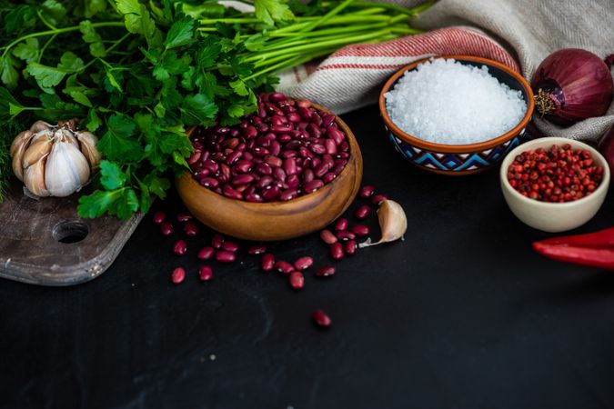 Kitchen counter with seasoning and herbs for cooking red kidney beans