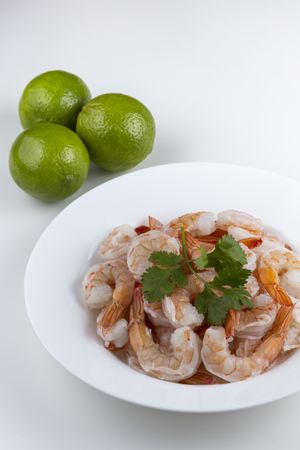 Fresh raw prawns on plain background.