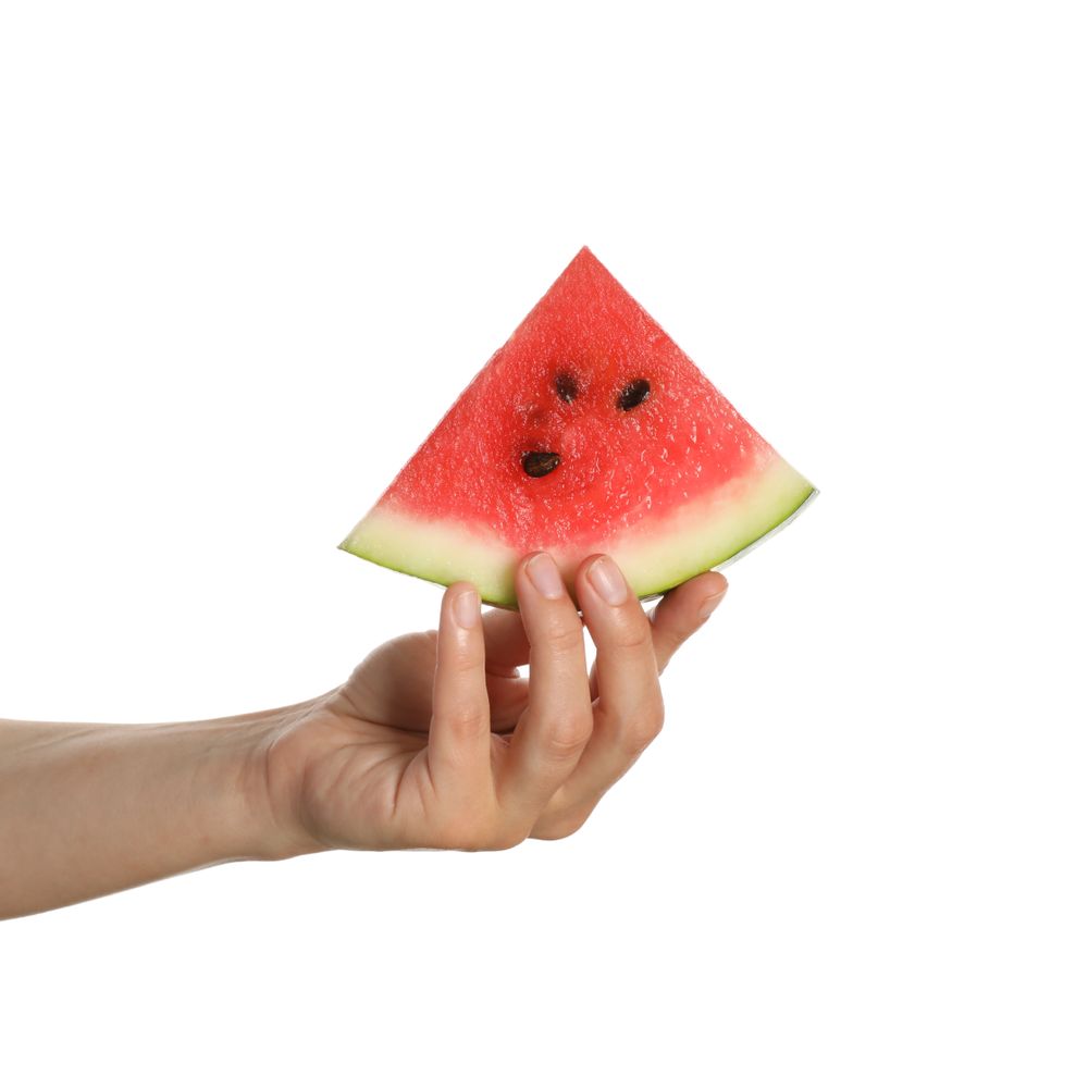 Female hand hold watermelon slice, isolated on blank background