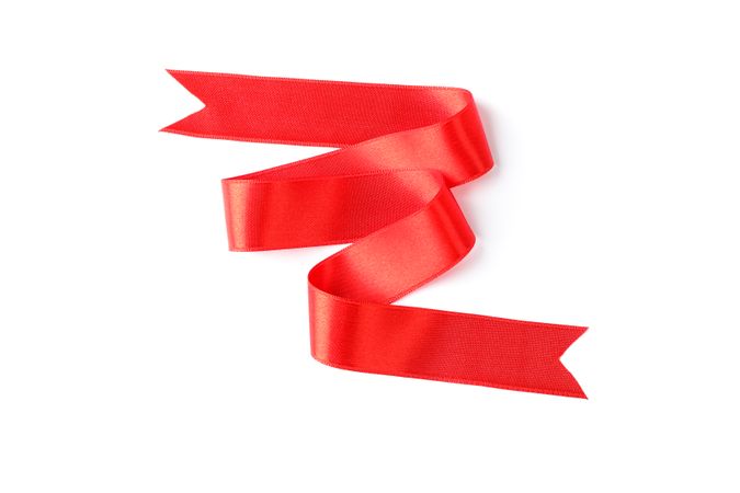 Red ribbon isolated on blank background. Gift concept