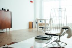 Vintage patio chair inside bright studio loft