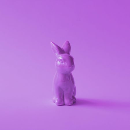 Purple plastic Easter bunny on purple background