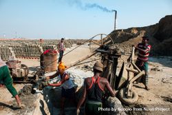 Laborers working at brick factory field in Dhaka, Bangladesh 0LXoP0