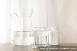 Pitcher and glasses by window 5kApLb