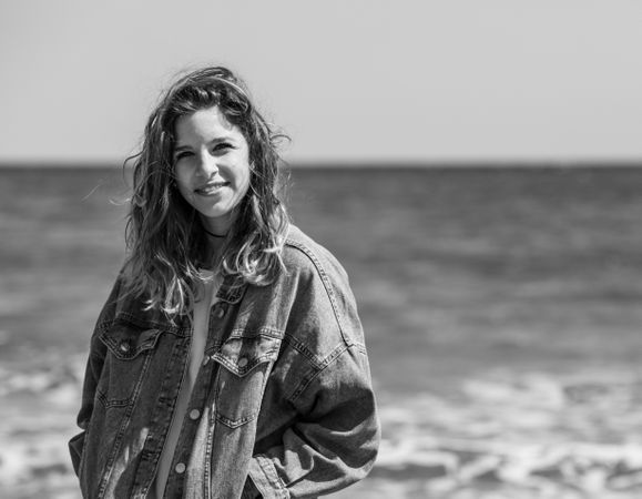 Young woman walking on seashore