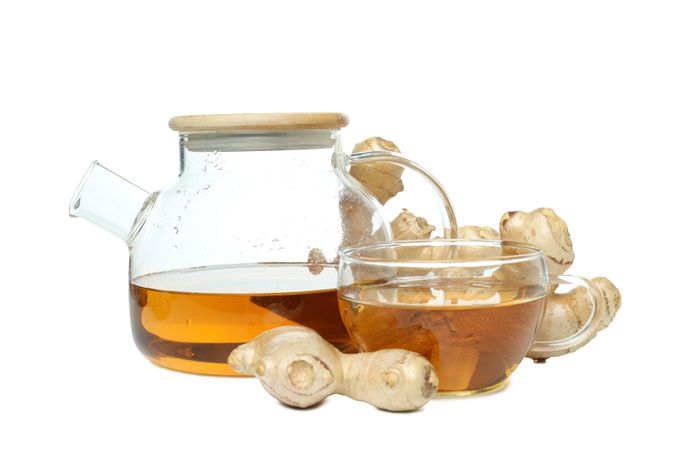cup and teapot with tea, ginger, isolated on plain background