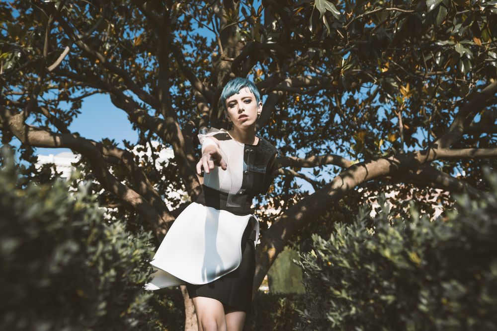 Informal young under tree in sunlight