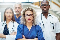 Multi-ethnic group of serious medical professionals