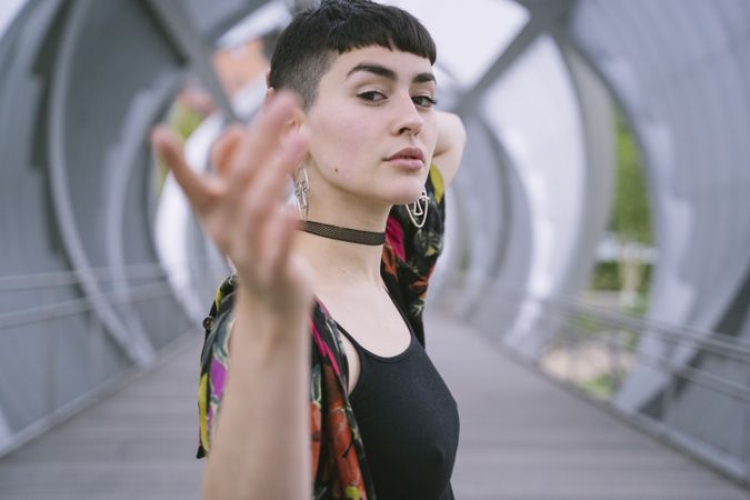 Woman in colorful shirt posing