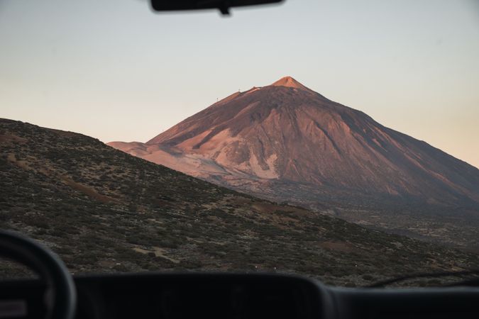 View of mountain through window of car