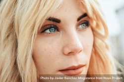 Portrait of blonde female with beautiful blue eyes 5r2vd5