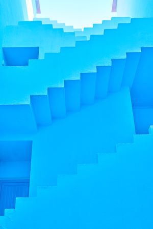 Blue building with straight interesting stairs