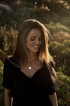 Cheerful woman looking away
