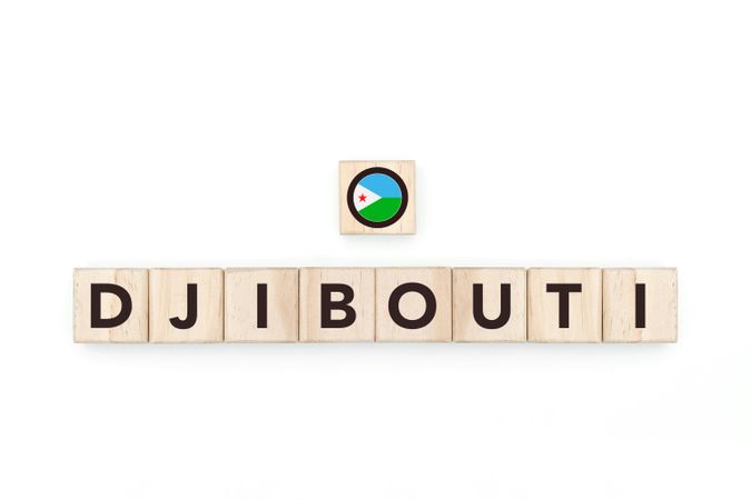 Wooden blocks bearing the name and flag of Djibouti. Djiboutian and African Culture, national identity, travel, and geography in a copy space design.