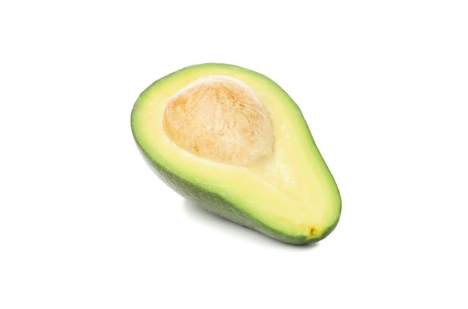 Half of ripe avocado isolated on blank background