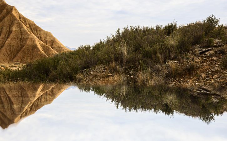 Water near stone desert hills