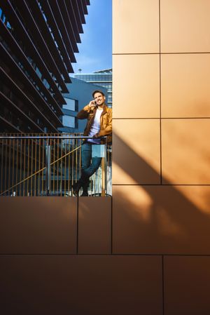Man using mobile phone in modern building