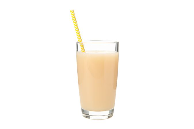 Banana juice isolated on studio background. Fresh fruit