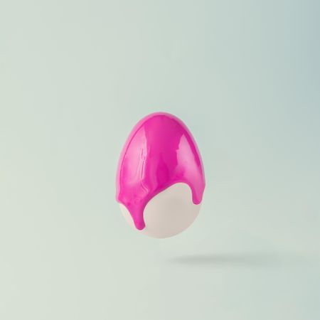 Easter egg with punchy pink paint dripping