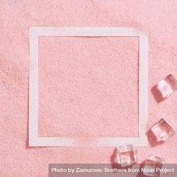 Pink sand with paper square outline and ice cubes 4M6ZEb