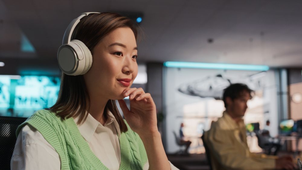 Female Asian Game Designer Using Desktop Computer, Designing Unique World And Characters In 3D modelling Software For Adventure Video Game.
