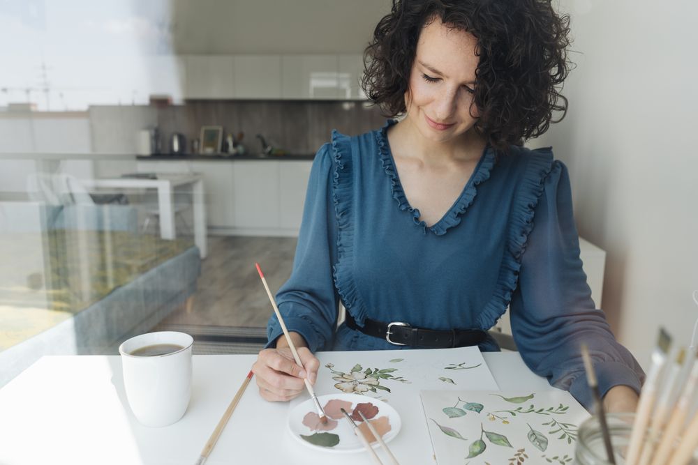 Woman painter working at home