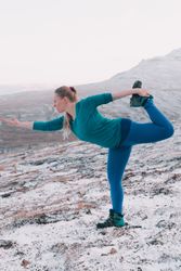 Woman posing on hill in snow