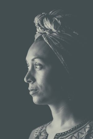 Black woman thoughtfully looking away
