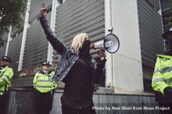 London, England, United Kingdom - June 6th, 2020: Woman holding loudspeaker among police bYqM1b