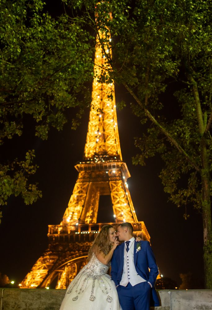 Overjoyed bridal pair enjoying in each other while kissing
