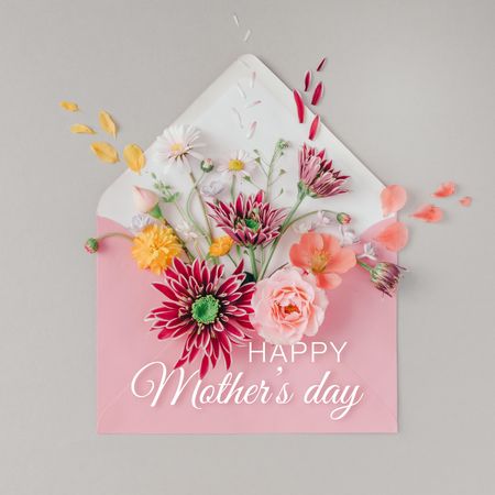Pink envelope full of various flowers with “Happy Mothers Day” text