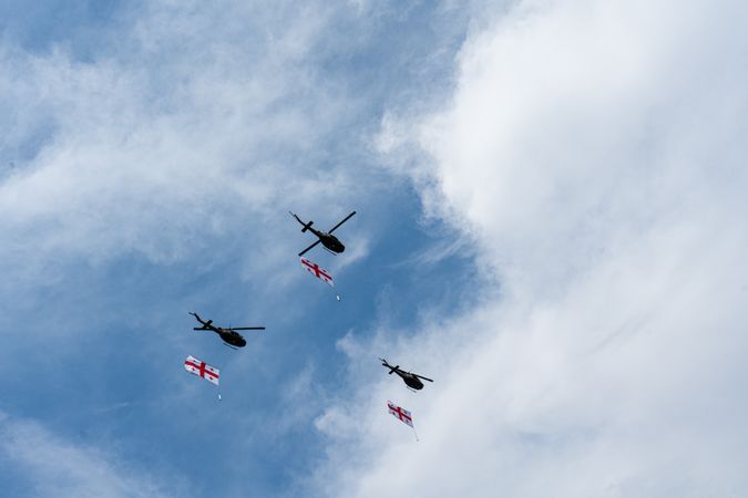 Helicopters fly in the sky of Tbilisi city