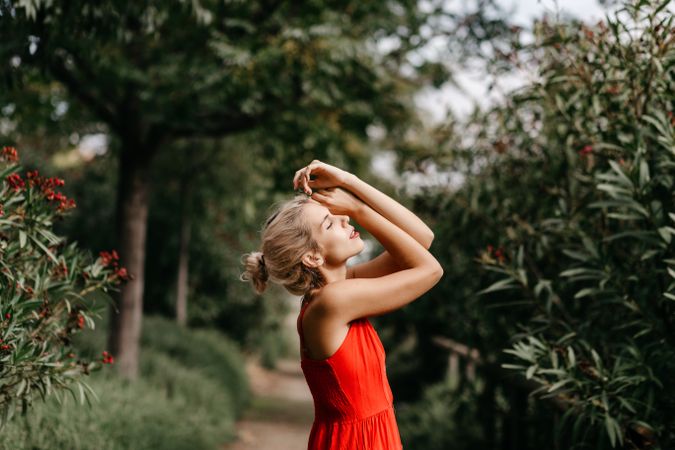 Dreamy young woman in summer garden
