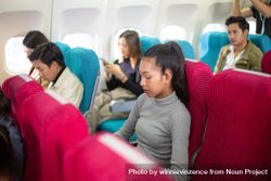 People traveling on airplane 4MRXab