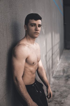 Strong male near concrete wall