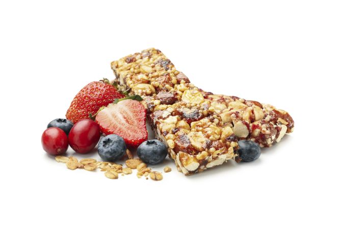 Tasty granola bars isolated on blank background