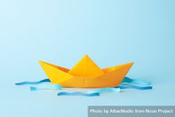 Paper boat and waves on blue background, space for text 4OdRwj