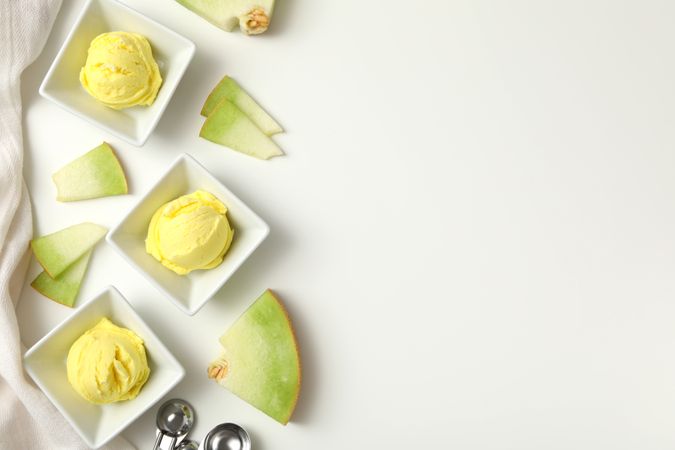 Ice cream scoops with slices of fresh melon