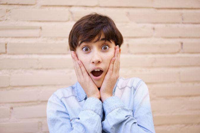 A Surprised Young Girl Expressing Her Excitement with Genuine Emotion and Enthusiasm