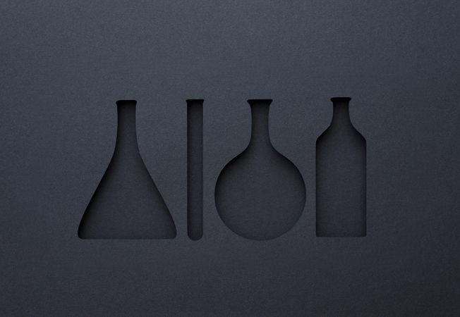 Silhouette cut outs of chemistry tools with paper