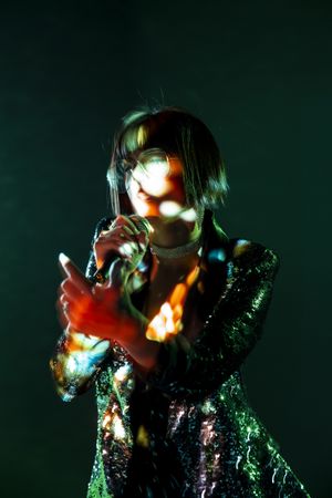 Stylish woman singing on stage