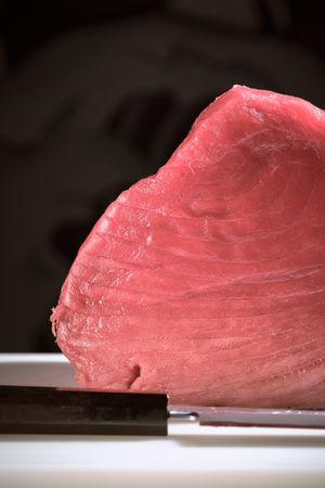 Fresh raw tuna on kitchen table