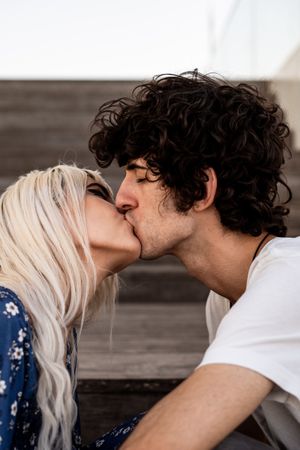 Loving couple kissing on stairs