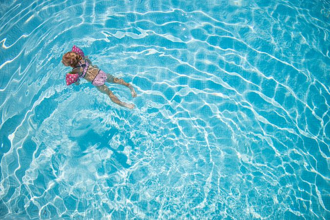 Aerial shot of child swimming